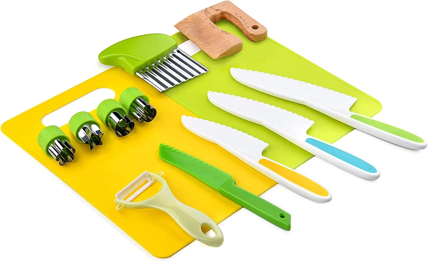 The Toyfetti Junior Chef Kids Cooking Set – Montessori-Inspired Safe Kitchen Tools includes child-safe utensils, three plastic knives, a peeler, crinkle cutter, wavy slicer, four veggie shapes, a scraper, and green and yellow cutting boards.