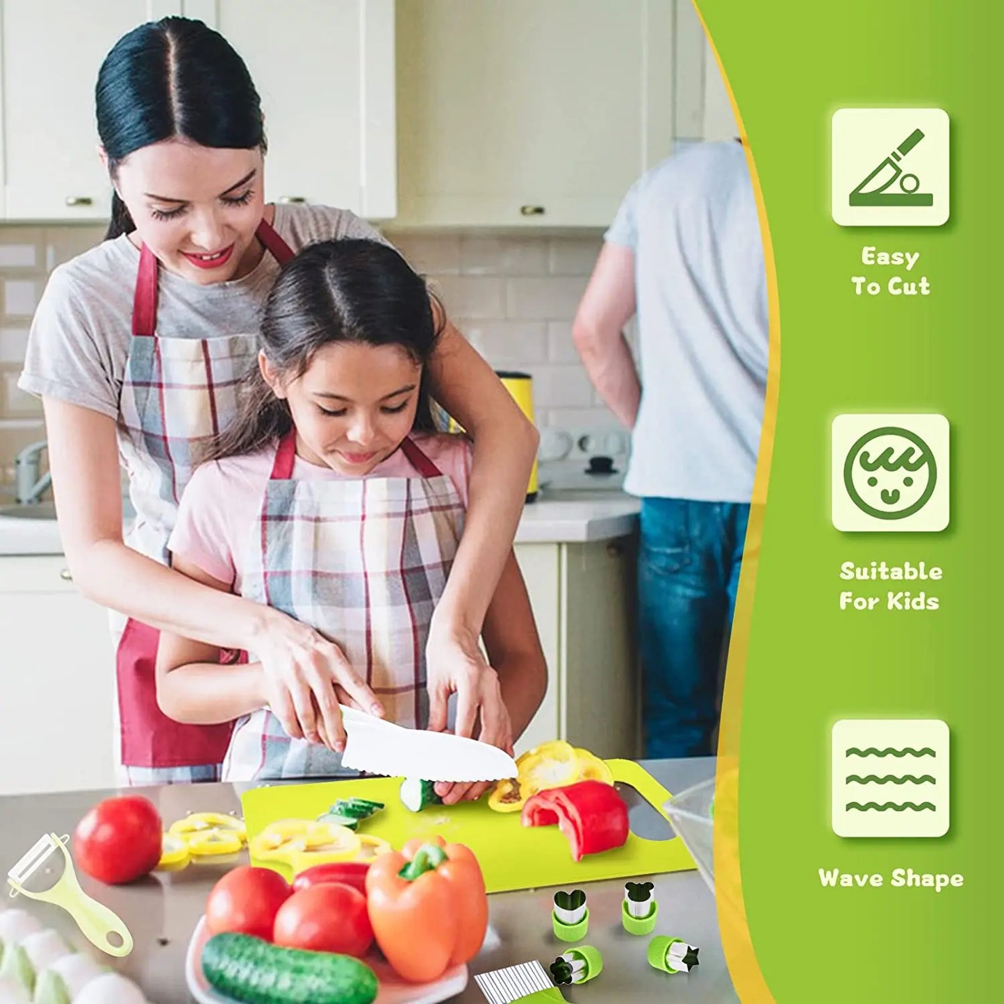 A woman and a young girl in aprons cut colorful veggies with kid-safe utensils from the Toyfetti Junior Chef Kids Cooking Set—Montessori-inspired kitchen tools for learning through play. Icons: Easy To Cut, Suitable for Kids, Wave Shape.