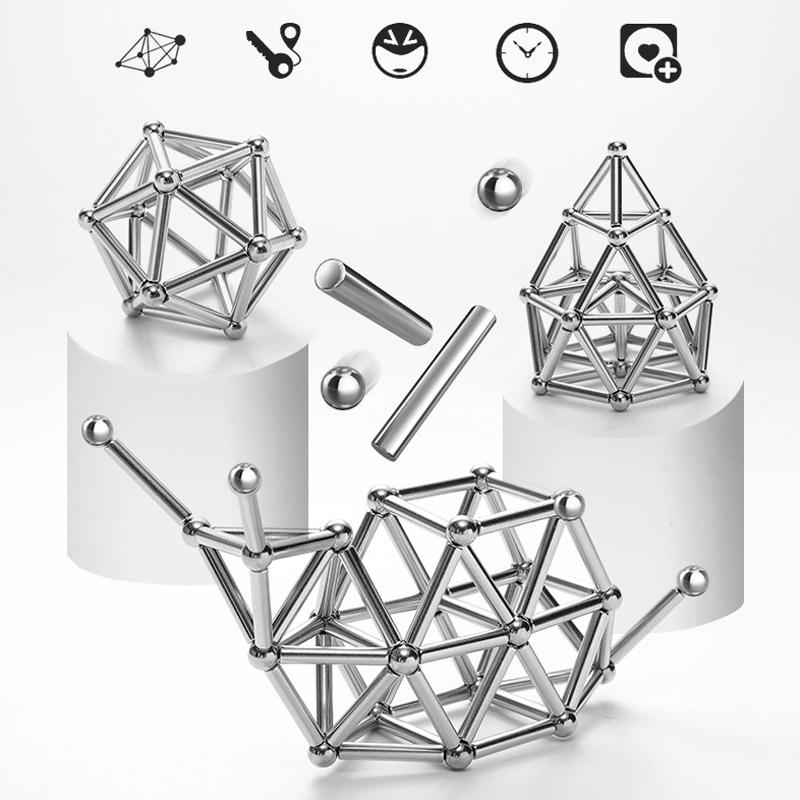 Toyfetti’s MagnoCraft – Magnetic Building Set for Creative Kids is displayed with assembled geometric shapes and loose pieces on white platforms, emphasizing spatial reasoning and fine motor skills development.