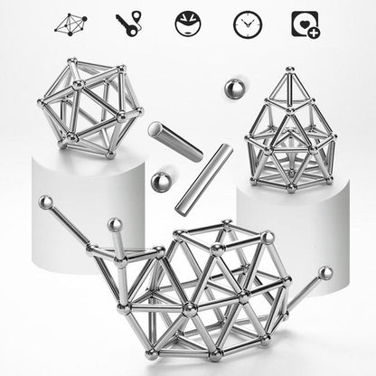 Toyfetti’s MagnoCraft – Magnetic Building Set for Creative Kids is displayed with assembled geometric shapes and loose pieces on white platforms, emphasizing spatial reasoning and fine motor skills development.