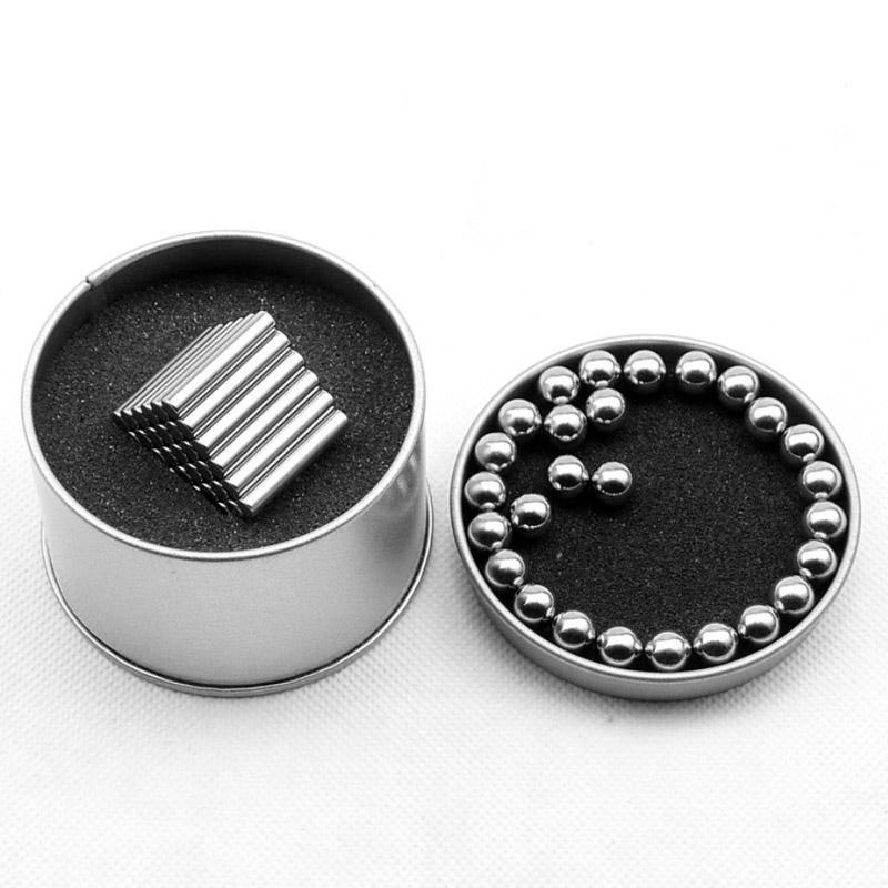 Two round tins from Toyfetti’s MagnoCraft Magnetic Building Set include metal rods and balls on black foam—ideal for boosting kids’ focus, logic, and imagination through creative magnetic construction play.