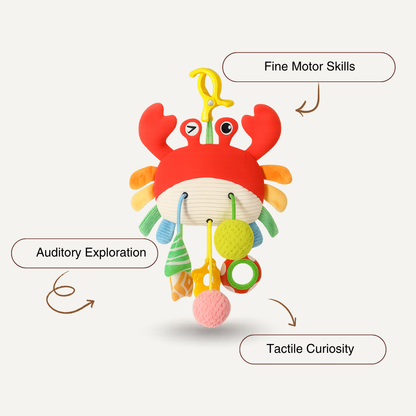The Toyfetti Crabby Clip-On Sensory Toy is a colorful hanging baby activity plush with rattles and textures to support fine motor skills, tactile curiosity, and auditory play. It features a yellow clip for easy attachment to cribs or strollers.