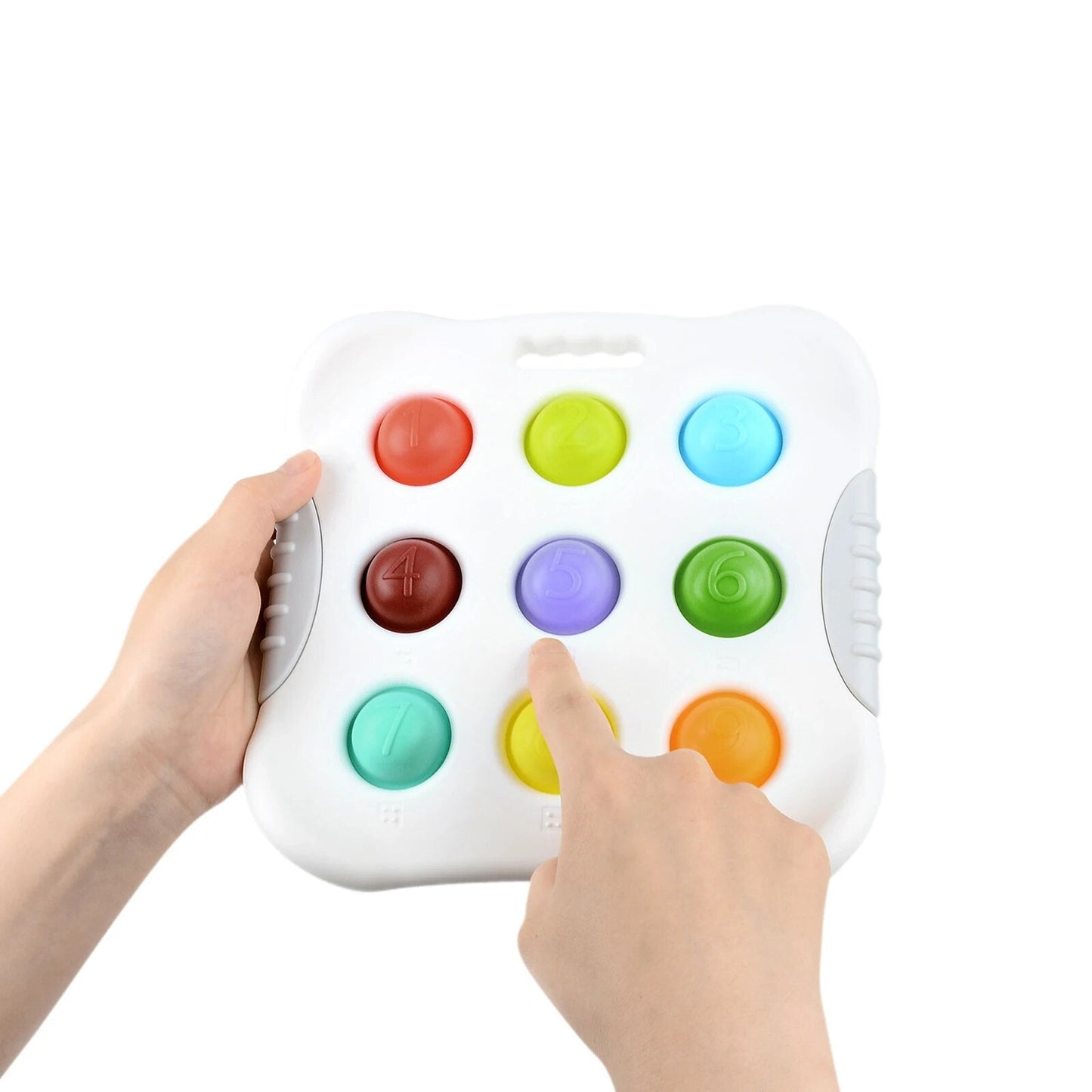 A person presses the purple button labeled 5 on the Toyfetti Press & Learn Pop Toy – a sensory bubble fidget tool with nine colorful, numbered bubbles for counting and calm.