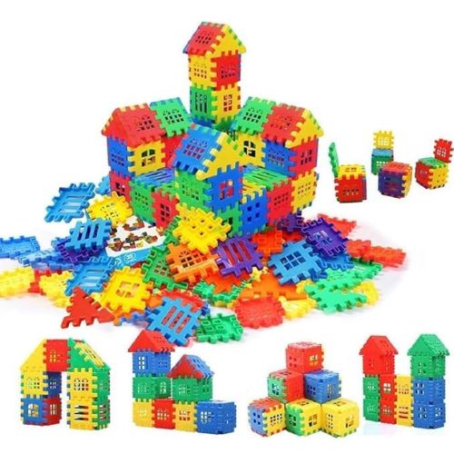 Toyfetti House Building Blocks – Creative Architecture Toy for Kids features colorful red, blue, green, and yellow plastic pieces arranged as houses, cubes, and scattered parts for endless building fun.