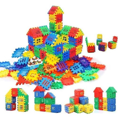 Toyfetti House Building Blocks – Creative Architecture Toy for Kids features colorful red, blue, green, and yellow plastic pieces arranged as houses, cubes, and scattered parts for endless building fun.