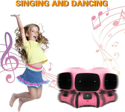 A young girl jumps beside Robomate | Jouw Muzikale Vriend - Slimme Robot by Toyfetti. Colorful notes and a purple treble clef highlight spraakontwikkeling. SINGING AND DANCING is written at the top.