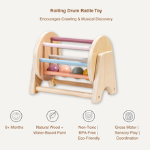 The Toyfetti Rolling Wooden Drum Toy – Montessori Sensory Drum, for babies 6+ months, features pastel bars and rolling balls. Made with non-toxic, BPA-free, eco-friendly materials, it encourages motor skills, sensory exploration, and musical play.