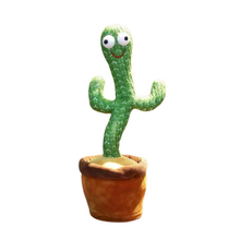 The Toyfetti CactusBuddy is a green cactus plush toy with big googly eyes and a smile, standing in a soft brown pot. This dancing, talking toy keeps kids smiling and engaged, adding charm to any space.