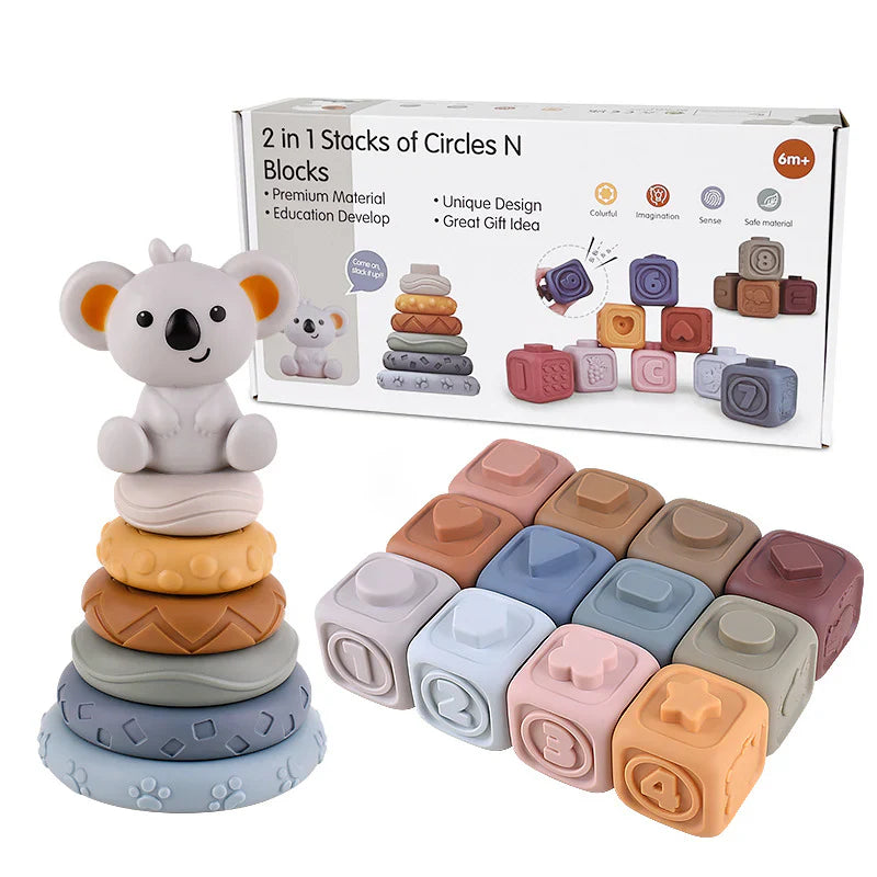 The Toyfetti CubbyKoala – Soft Silicone Teether & Stacking Toy Set for Babies includes pastel rings with a koala teether and 12 numbered, shaped soft blocks. Suitable for ages 6 months and up, as shown on the packaging in the background.