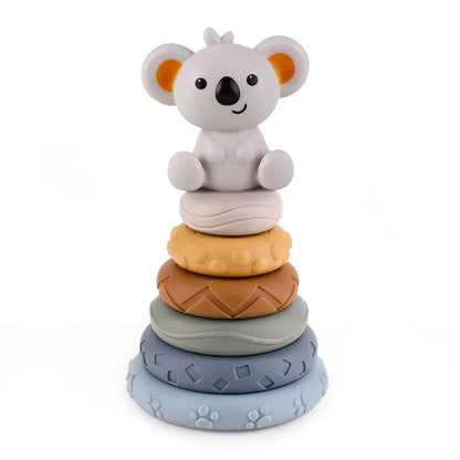 The Toyfetti CubbyKoala – Soft Silicone Teether & Stacking Toy Set for Babies features a gray koala atop four textured rings in yellow, brown, blue, and gray—ideal as both a stacking toy and teether.