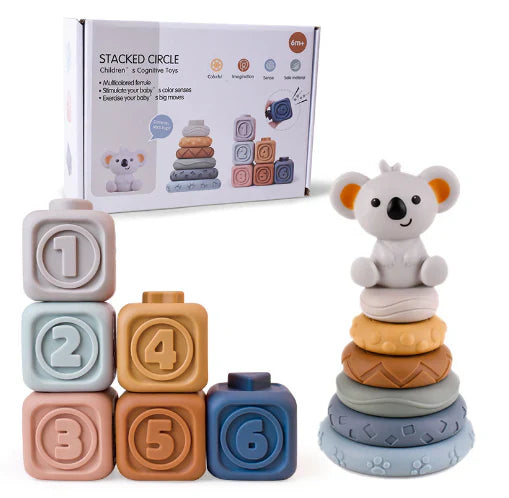 The Toyfetti CubbyKoala – Soft Silicone Teether & Stacking Toy Set for Babies features six pastel, numbered soft blocks and a koala topper, shown in front of its box with playful images and a cute koala illustration.