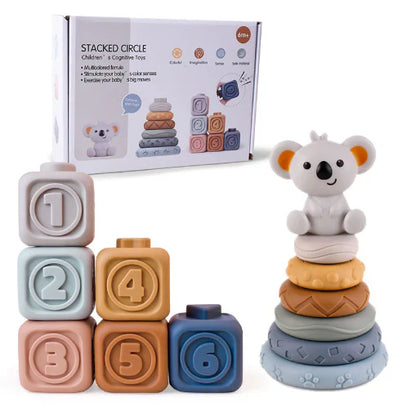 The Toyfetti CubbyKoala – Soft Silicone Teether & Stacking Toy Set for Babies features six pastel, numbered soft blocks and a koala topper, shown in front of its box with playful images and a cute koala illustration.