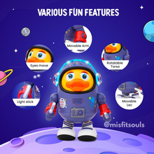 The Toyfetti DazzleDuck – Light-Up Musical Dancing Duck features movable arms and legs, a rotatable torso, light effects, musical sound, and moving eyes, all set on a vibrant space-themed purple planet.