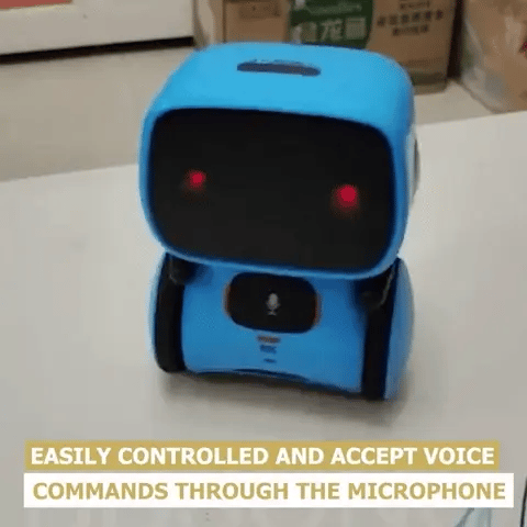 The Toyfetti Robomate | Jouw Muzikale Vriend – Slimme Robot is a small blue interactive robot with red eyes that turns its head. Easily controlled, it accepts voice commands—perfect for spraakontwikkeling in young users.