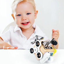 A baby smiles while playing with the Toyfetti Montessori Lock & Key Learning Cube, enjoying hands-on fun and boosting fine motor skills.