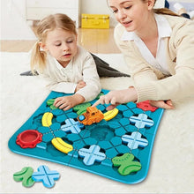 A woman and a young girl play on a white carpet with the Toyfetti Trackmaster, an interactive treinspoorset that stimulates creativity and logical thinking. Colorful pieces and gears are scattered as they move a small orange toy truck on the tracks.