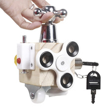 A hand holds the Toyfetti Montessori Lock & Key Learning Cube—a hands-on sensory toy with a faucet handle, fidget spinner, red button, caster wheel, and key on a chain—perfect for building kids’ fine motor skills.