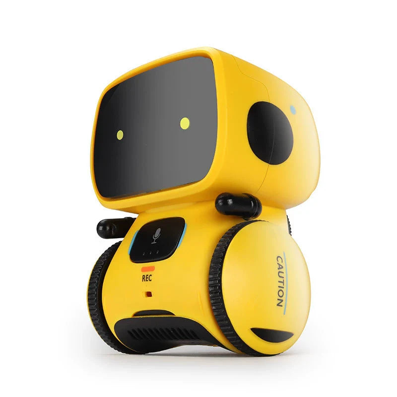 The Toyfetti Robomate | Jouw Muzikale Vriend - Slimme Robot is a small yellow robot with black wheels, a screen face showing two yellow eyes, CAUTION on its side, a built-in mic, and REC button to support spraakontwikkeling.