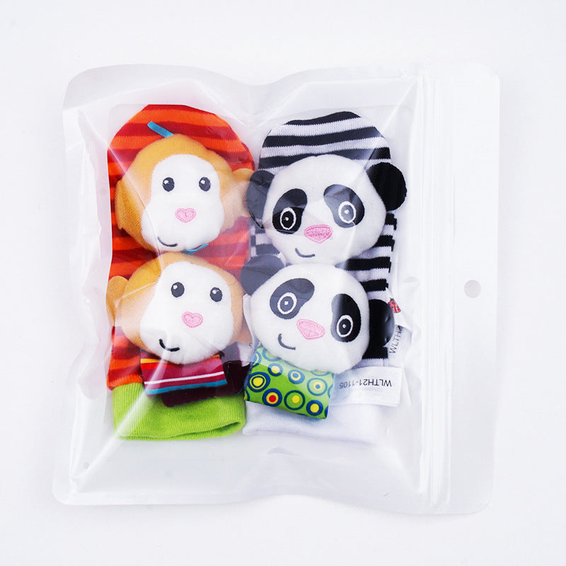 The Toyfetti Plush Animal Baby Socks & Wrist Rattle Set includes two pairs of plush animal socks: one with red and orange striped monkeys and one with black-and-white striped pandas with green polka dots, all in a clear resealable bag.
