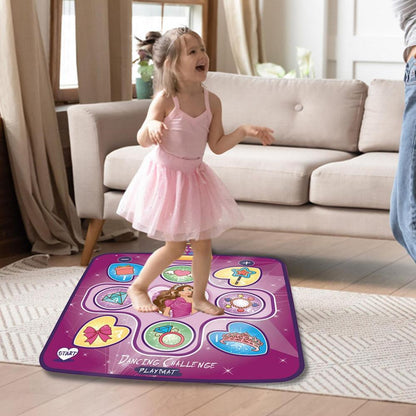 A young girl in a pink tutu dances joyfully on the Toyfetti Interactive Dance Light Mat – LED Movement Game for Kids in the living room, smiling with arms raised. The mat has dance illustrations, built-in music, and fun rhythm-game functions.