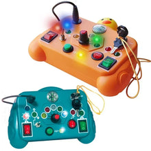 Two vibrant Toyfetti BusyBoard Logic & Light Panels—one orange with a rubber duck keychain, one teal—feature buttons, switches, lights, and knobs. Perfect Montessori-inspired sensory boards for kids to explore and learn through tactile play.