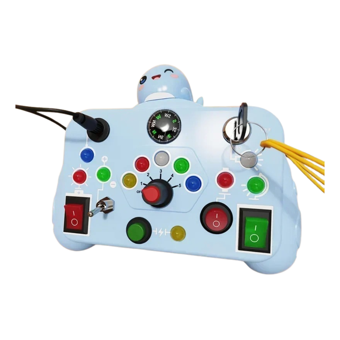 The Toyfetti BusyBoard Logic & Light Panel is a Montessori switch board for curious kids, featuring colorful buttons, switches, dials, wires, a compass, and a cartoon seal to promote sensory play and interactive fun.