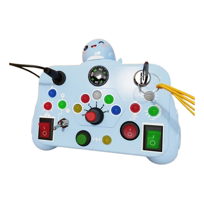 The Toyfetti BusyBoard Logic & Light Panel is a Montessori switch board for curious kids, featuring colorful buttons, switches, dials, wires, a compass, and a cartoon seal to promote sensory play and interactive fun.