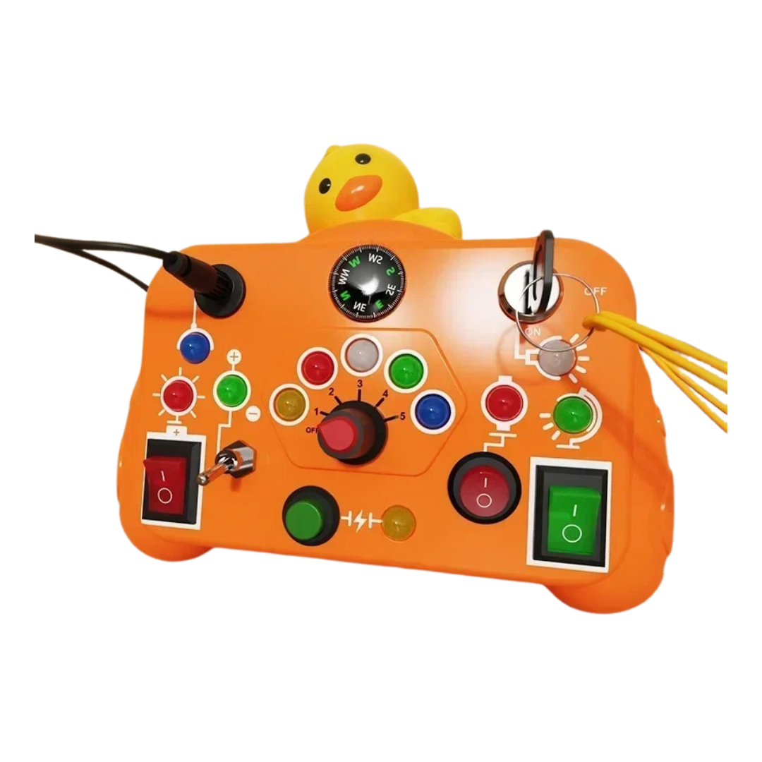 The Toyfetti BusyBoard Logic & Light Panel is an orange Montessori switch board featuring switches, buttons, dials, a compass, cables, and a yellow rubber duck—perfect sensory play for curious kids.