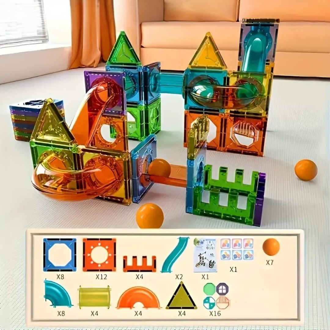 The Toyfetti BrightTracks Magnetic Marble Run – Build, Click, Light Up! is set up on a light floor with orange balls close by. Below, an inventory lists the set’s marble run pieces, slides, and accessories, each labeled with quantities.