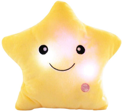 The Toyfetti GlowPals Light-Up Plush Night Buddy is a yellow star pillow with glowing lights, a smiling face, and two black eyes. It serves as a cozy night light for kids, featuring an ON button on the lower right side.