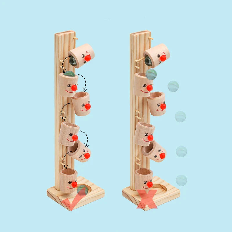 Toyfetti Clown Track Wooden Play Tower offers creative building and rolling ball fun. Stacked, smiling cup sections let kids guide marbles along the marked path to boost fine motor skills and thinking. Blue background.