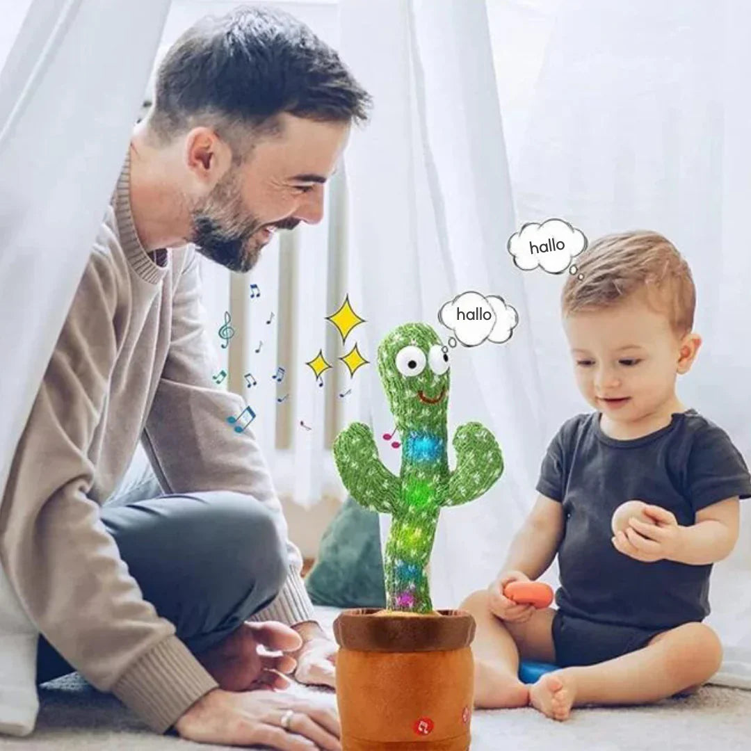 A man and a toddler sit on the floor smiling at the Toyfetti CactusBuddy – a dancing, talking plush toy in a pot. Cartoon speech bubbles say “hallo” as colorful sparkles and music notes swirl around it, keeping kids smiling and engaged.