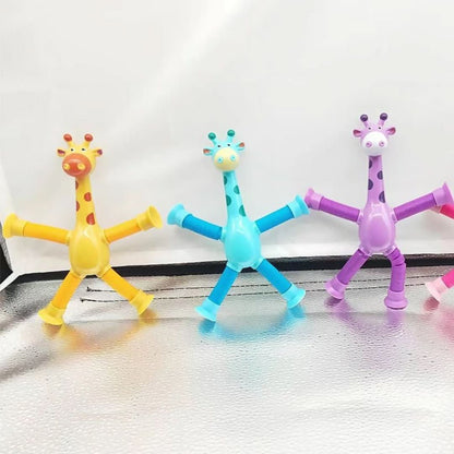 The Toyfetti Stretchy Giraffe Trio features yellow, blue, and purple bendable sensory toys with suction cup hands and feet—perfect for kids to fidget or stick upright on surfaces.