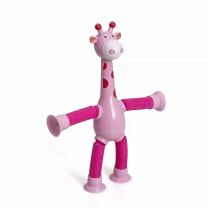 The Toyfetti Stretchy Giraffe Trio features pink, bendable sensory toys with red spots, long flexible limbs, and suction cups on hands and feet—perfect as toddler party favors or fidget toys. Shown upright against a plain white background.