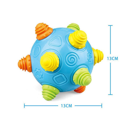 The Toyfetti Sensory Music Ball – Interactive Light & Sound Toy for Babies and Toddlers features textured nubs in yellow, green, and orange on blue, measures 13x13 cm, and is perfect for early development and sensory play.